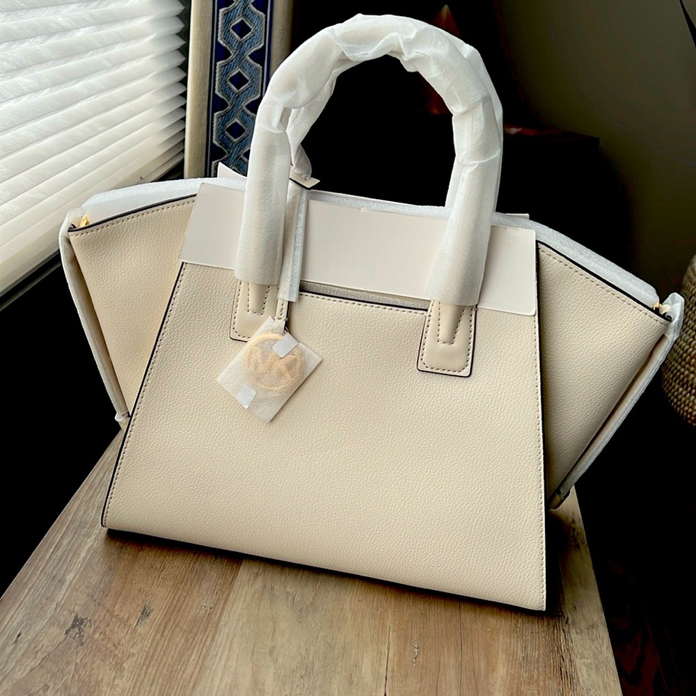 Cream colored MK Authentic bag. Brand new never used.  $400.00